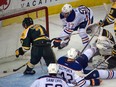 Anton Slepyshev (42) scores with Connor McDavid (97) at the net  as the Edmonton Oilers rookies win the annual exhibition game matchup with the Canadian Interuniversity Sport champions University of Alberta Golden Bears at Rexall Place on Sept. 16, 2015.