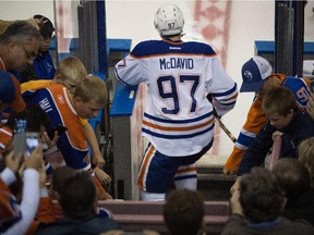 Connor McDavid (97) enter the ice for the annual matchup between the Oilers rookies and the Canadian Interuniversity Sport (CIS) champions, the University of Alberta Golden Bears in Edmonton on Sept. 16, 2015.