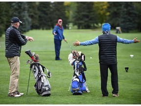 Victoria Golf Course head pro Kevin Hogan, left, and assistant pro Matteo Piscopo demonstrate what happens when slow play creates tension on a golf course.