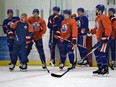 Edmonton Oilers head coach Todd McLellan gives directions to his players at training camp in Leduc, Alta., on Sept. 19, 2015.