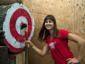 Kat Spencer is a competitive axe thrower who just opened a new axe-throwing business where people throw axes at targets.