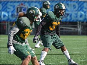 Aaron Grymes (36) and Otha Foster (37) prepare at Clarke Field on Sept. 23, 2015, for the upcoming game against the B.C. Lions.