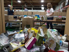 Volunteers work at Edmonton's Food Bank on Sept. 23, 2015. A recent report includes statistics on people who use the city's food bank.
