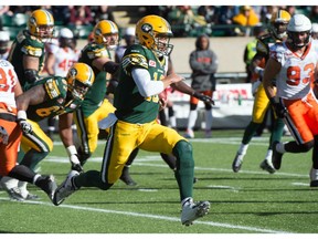 Quarterback Mike Reilly (13) runs as the Eskimos beat the BC Lions 29-23 in Edmonton, September 26, 2015.