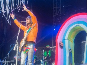 The Flaming Lips perform Sunday afternoon in the rain during  Sonic Boom Music Festival at Borden Park in Edmonton on September 6, 2015.