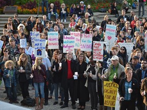 People gathered in solidarity and vigil for Syrian and other refugees in crisis on the front steps of the Alberta Legislature in Edmonton on Sept. 8, 2015.
