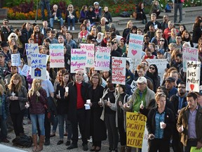 People gathered in solidarity and vigil for Syrian and other refugees in crisis on the front steps of the Alberta Legislature in Edmonton, Sept. 8, 2015.