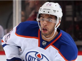 GLENDALE, AZ - OCTOBER 15:  Darnell Nurse #25 of the Edmonton Oilers skates with the puck during the NHL game against the Arizona Coyotes at Gila River Arena on October 15, 2014 in Glendale, Arizona.  The Coyotes defeated the Oilers 7-4.