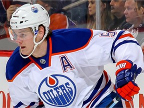 WINNIPEG, CANADA - FEBRUARY 16: Mark Fayne #5 of the Edmonton Oilers takes part in the pre-game warm up prior to NHL action against the Winnipeg Jets on February 16, 2015 at the MTS Centre in Winnipeg, Manitoba, Canada. This game marked the 300th of Fayne's career.