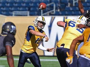 Edmonton Wildcats quarterback Jordan Olson throw a pass during a Prairie Football Conference junior game against the Winnipeg Rifles at Investors Group Field in Winnipeg  on Sun., Sept. 27, 2015.