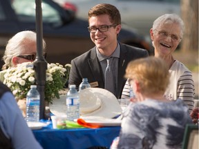 Jon Carson, Edmonton-Meadowlark MLA, visits with his constituents including Jean Bach, right, at Jasper Place Continuing Care Centre during a 50th anniversary celebration of the centre in Edmonton on Aug. 27, 2015.