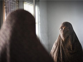 Zunera Ishaq stands for a portrait in her home in Mississauga, Ont., on Feb. 11, 2015.