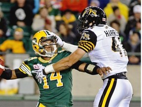 Hamilton Tiger-Cats linebacker Erik Harris gets in the face of Edmonton Eskimos rookie quarterback James Franklin, literally, during a Canadian Football League game at Commonwealth Stadium on Aug. 21, 2015.