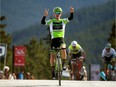 Tom Jelte Slagter of the Netherlands celebrates as he approaches the finish line to win Stage 4 of the 2015 Tour of Alberta race from Jasper to Marmot Basin ski area on Saturday, September 5, 2015.