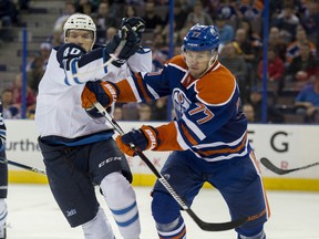 Oscar Klefbom  of the Edmonton Oilers gets past Joel Armia of the Winnipeg Jets at Rexall Place in Edmonton. Shaughn Butts / Edmonton Journal