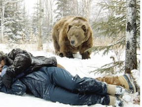 Jewel Staite, Shawn Roberts and Whopper the Bear in a scene from 40 Below and Falling, the world’s first 3-D rom-com, filmed locally and directed by Dylan Pearce
