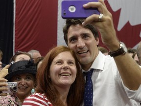 Liberal Leader Justin Trudeau takes a selfie with a supporter following a campaign stop in Mount Pearl, N.L., Sunday, Sept.20, 2015.