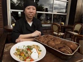 Chef Binh Huynh shows off the generous cinnamon buns and  weekly hash special from the Sugarbowl.