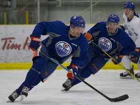 Taylor Hall and Connor McDavid skate laps at the Edmonton Oilers open training camp in Leduc on Sept. 18.