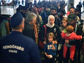 Migrants make their way to board a train leaving for the Austrian border at the Keleti railway station on Sept. 14, 2015 in Budapest, Hungary.