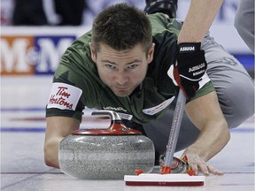 Skip Mike McEwen throws in draw 14 against Kevin Koe at the 2013 Roar Of The Rings championship in Winnipeg on December 6, 2013. Mike McEwen's curling team was arguably the best in Canada over the first half of the season in winning five of six events. This could finally be the year the foursome represents Manitoba at the Tim Hortons Brier after losing the provincial men's final in four of the last five years.