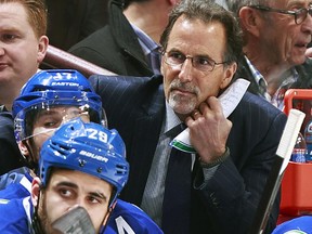 Head coach John Tortorella of the Vancouver Canucks looks on from the bench during their NHL game against the New York Rangers at Rogers Arena April 1, 2014 in Vancouver. New York won 3-1.