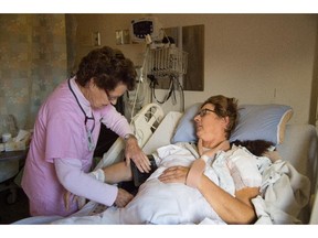 Elaine Armstrong with patient Diana Morse at the University of Alberta Hospital. Armstrong worked her last shift as a nurse Sept. 3 and is retiring after 58 years.