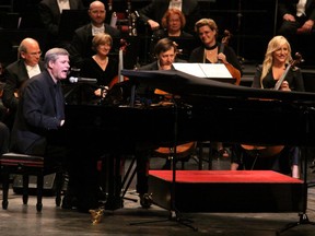 Tory Leader Stephen Harper sings "With a Little Help from My Friends" and plays piano during a surprise appearance at the National Arts Centre Gala on Oct. 3, 2009 in Ottawa.