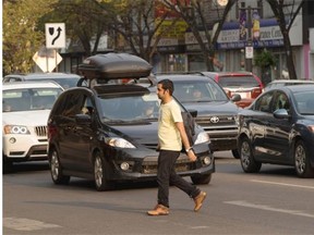 A pedestrian crosses Whyte Avenue earlier this week.