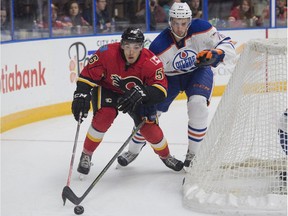 Ben Betker of the Edmonton Oiler prospects shadows Ryan Lombergf the Calgary Flames prospects at the South Okanagan Events Centre in Penticton, B.C. on Sept. 12, 2015.