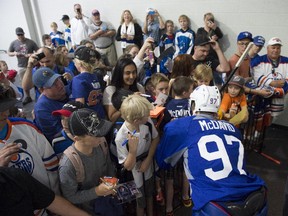 Connor McDavid signs autographs before the Edmonton Oilers prospects practice at the South Okanagan Events Centre in Penticton, B.C.
