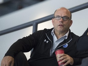 Edmonton Oilers GM Peter Chiarelli watches the Oilers' prospects practise at the South Okanagan Events Centre in Penticton, B.C.