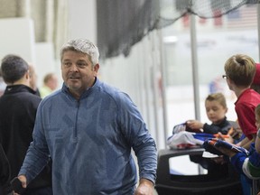 Edmonton Oilers head coach Todd McLellan walks through the crowd after on Oilers Prospects practice at the South Okanagan Events Centre in Penticton.