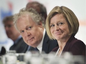 Alberta Premier Rachel Notley and former Quebec premier Jean Charest attend a business luncheon in Montreal on Monday, Sept. 28, 2015.