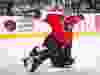 Philadelphia Flyers goalie Ron Hextall makes an open-toe kick save during 1997 NHL action.