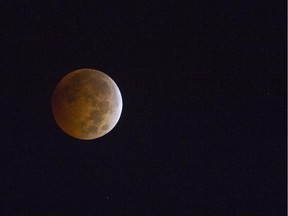 This photo taken on October 8, 2014, shows the moon during a total lunar eclipse.