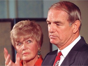 Don Getty, watched by his wife Margaret, tells a press conference he is stepping down as premier in 1992.