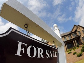Alberta housing sales will decline more than 21 per cent in 2015 compared with 2014 levels, the Canadian Real Estate Association said Tuesday.