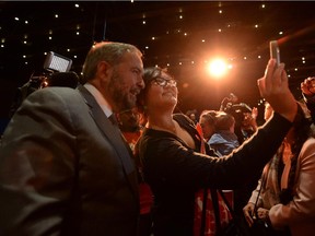 An NDP supporter snaps a selfie with federal NDP  Leader Tom Mulcair at a rally in Edmonton  on Thursday, Sept. 10, 2015.