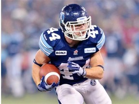 Toronto Argonauts running back Chad Kackert runs with the football against the Calgary Stampeders during the 2012 Grey Cup at Toronto on Nov. 25, 2012.