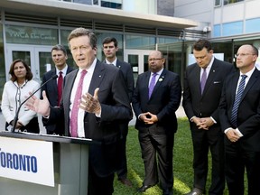 Toronto Mayor John Tory hosts the meeting of Big City Mayors after their tour of the downtown YWCA on Thursday September 24, 2015. Edmonton Mayor Don Iveson is standing just behind Tory on the right.