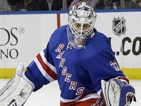 New York Rangers goalie Cam Talbot defends the net against a shot at goal by Los Angeles Kings center Trevor Lewis (22) during the first period of an NHL hockey game, Tuesday, March 24, 2015, at Madison Square Garden in New York.