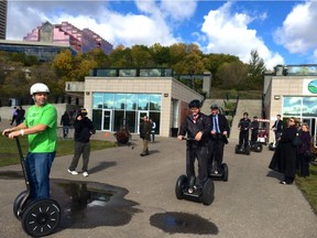 Chris Szydlowski, owner of River Valley Adventure Co., leads Alberta Tourism Minister David Eggen and assistant deputy minister Chris Heseltine on a Segway ride on Monday, Sept. 21, 2015.