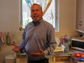 Edmonton Eskimos CEO and president Len Rhodes stands in the kitchen of the apartment he grew up in, in the Cotes des Neiges neighbourhood in Montreal.