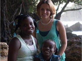 Sarah Wallace and her unofficially adopted children in Haiti.