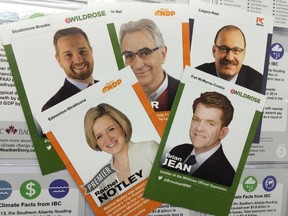 The Insurance Bureau of Canada is sending out trading cards that have pics of each Alberta MLA on one side and facts about climate change damage on the back.