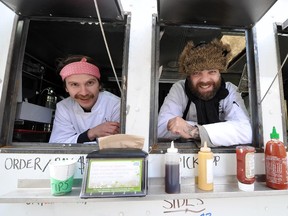 Ryan Brodziak, left,  and Mark Bellows in their food truck, The Local Omnivore. They are opening a restaurant with the same name.