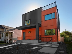 The home stands out with bold colours, a cube-shaped design and rooftop deck.