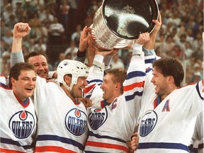From left, Esa Tikkanen, Mark Messier, Wayne Gretzky and Kevin Lowe celebrate the Edmonton Oilers' Stanley Cup victory in 1988.