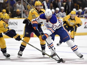 Edmonton Oilers left wing Benoit Pouliot (67)  needs to toughen up if he hopes to stay with the team. hockey commentator Craig Button says.